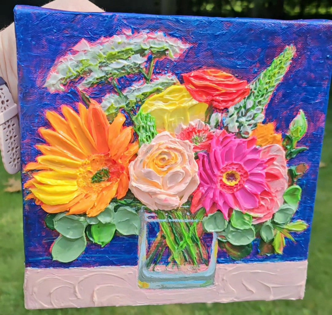 Painting of an orange and pink bouquet