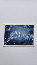 Mini painting of the moon with wispy clouds