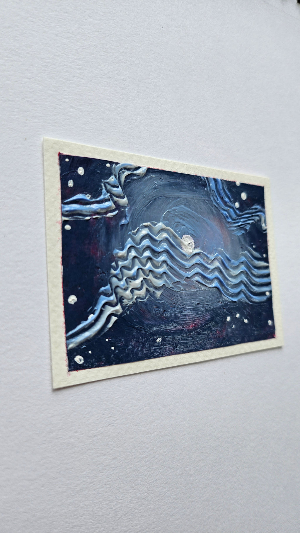 Mini painting of the moon with wispy clouds