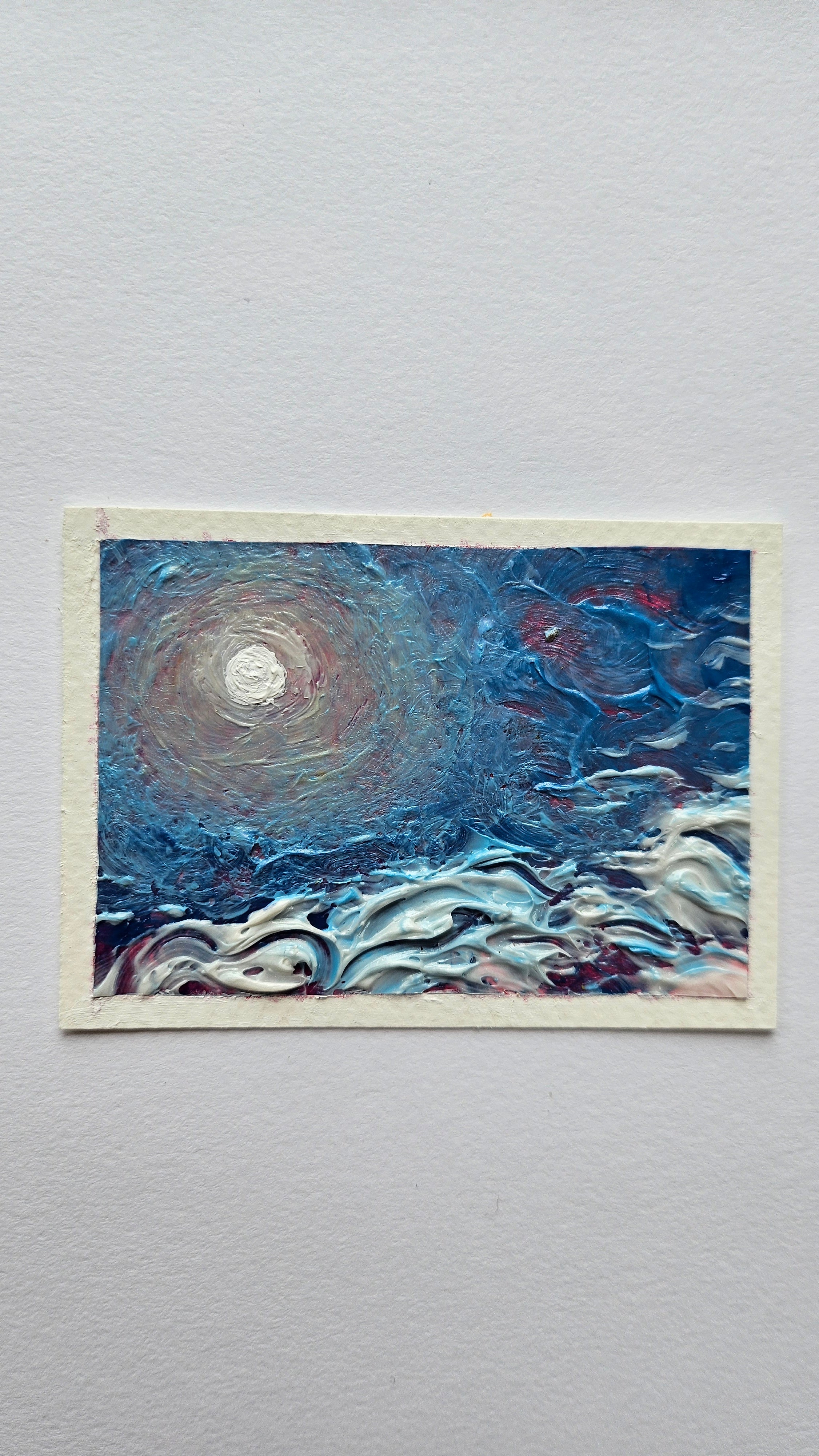 Mini painting of the sun and high clouds