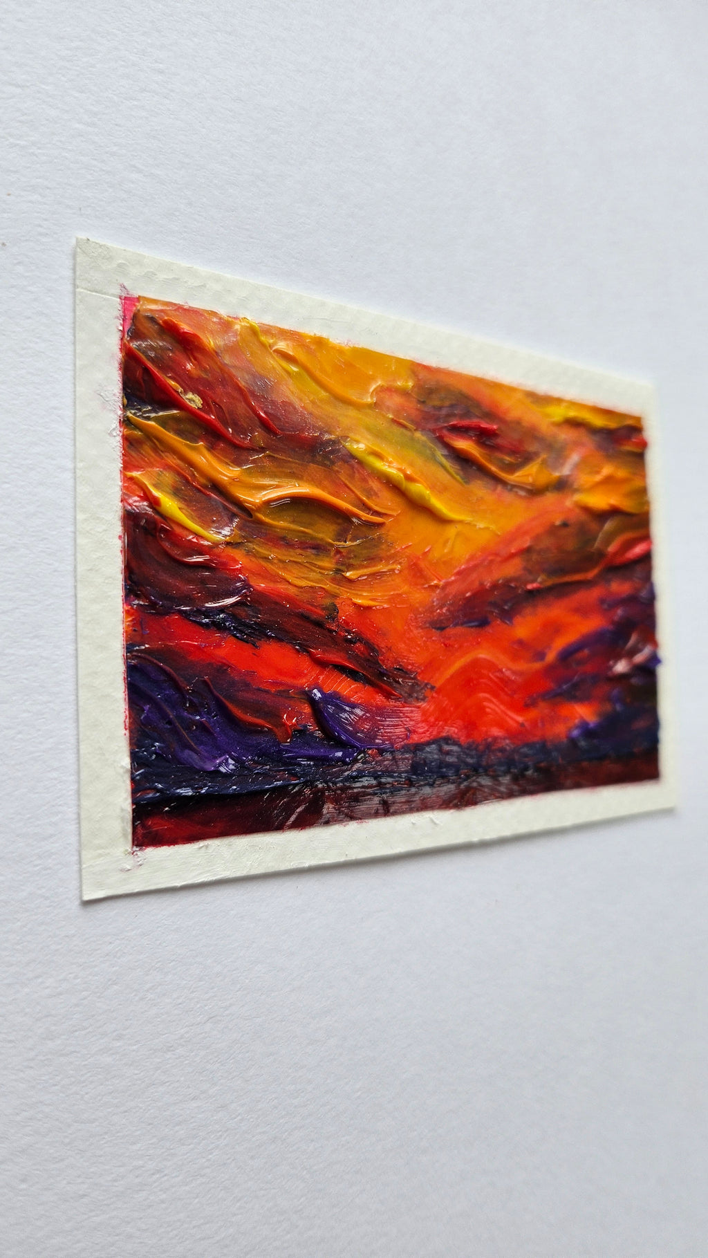 Mini painting of a bloodred sunset