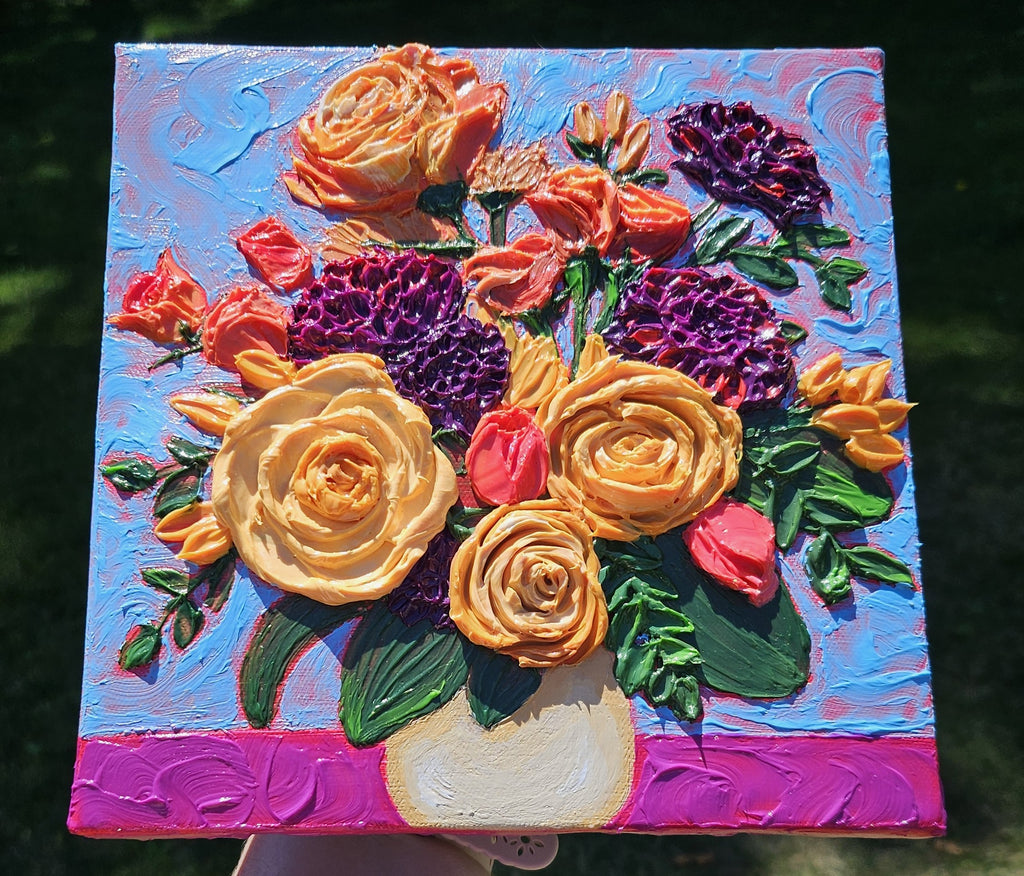 Painting of an orange, yellow, and purple bouquet