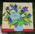 Painting of a blue and purple bouquet
