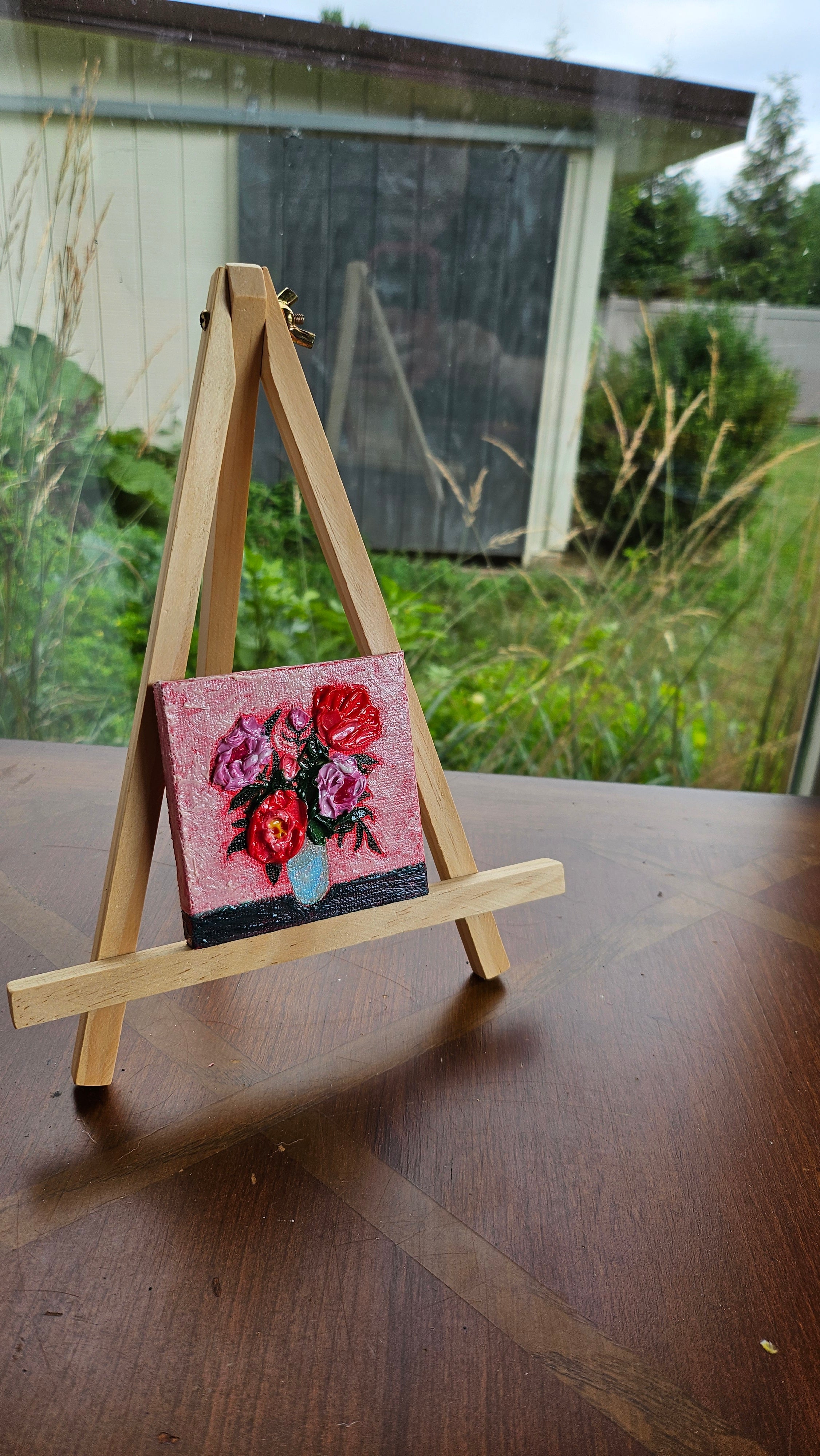 Mini painting of a red and pink bouquet