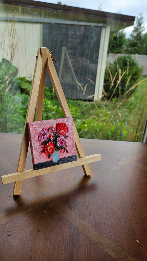 Mini painting of a red and pink bouquet