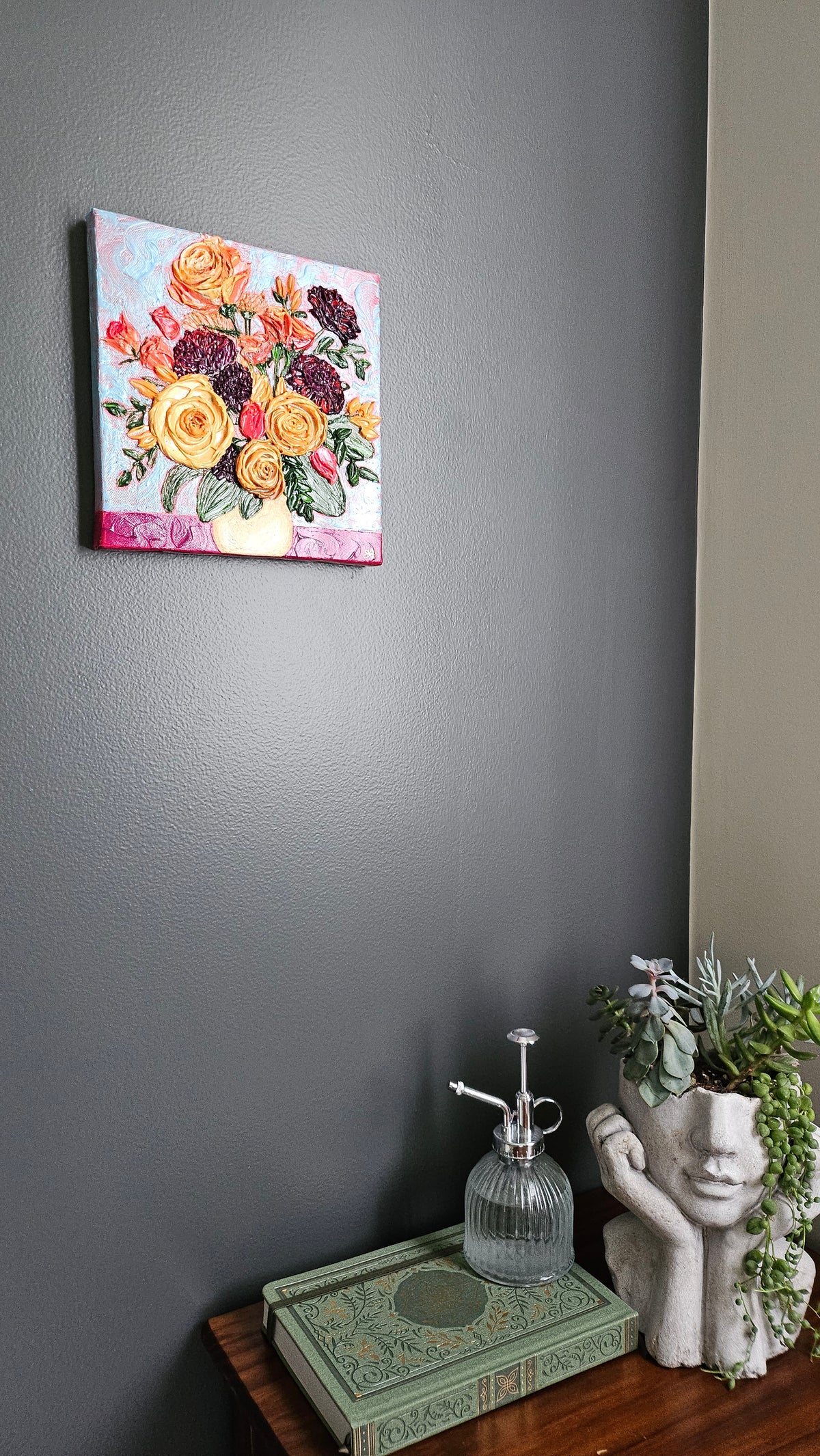 Painting of an orange, yellow, and purple bouquet