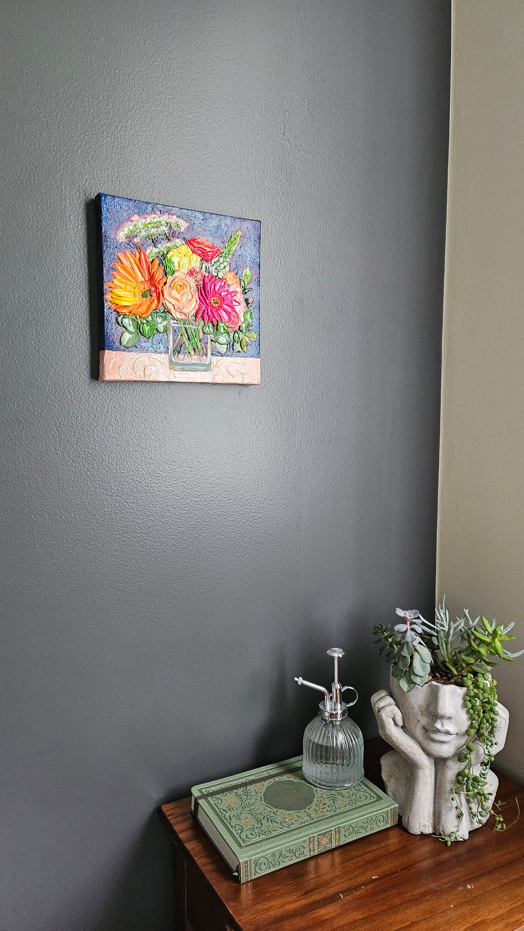 Painting of an orange and pink bouquet