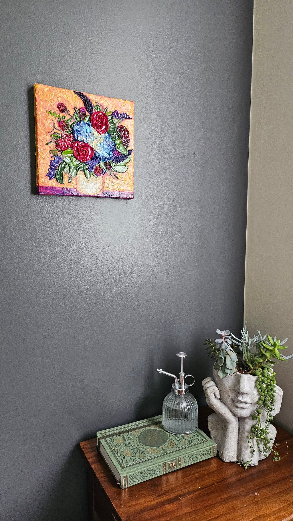 Painting of a blue, red, and purple bouquet