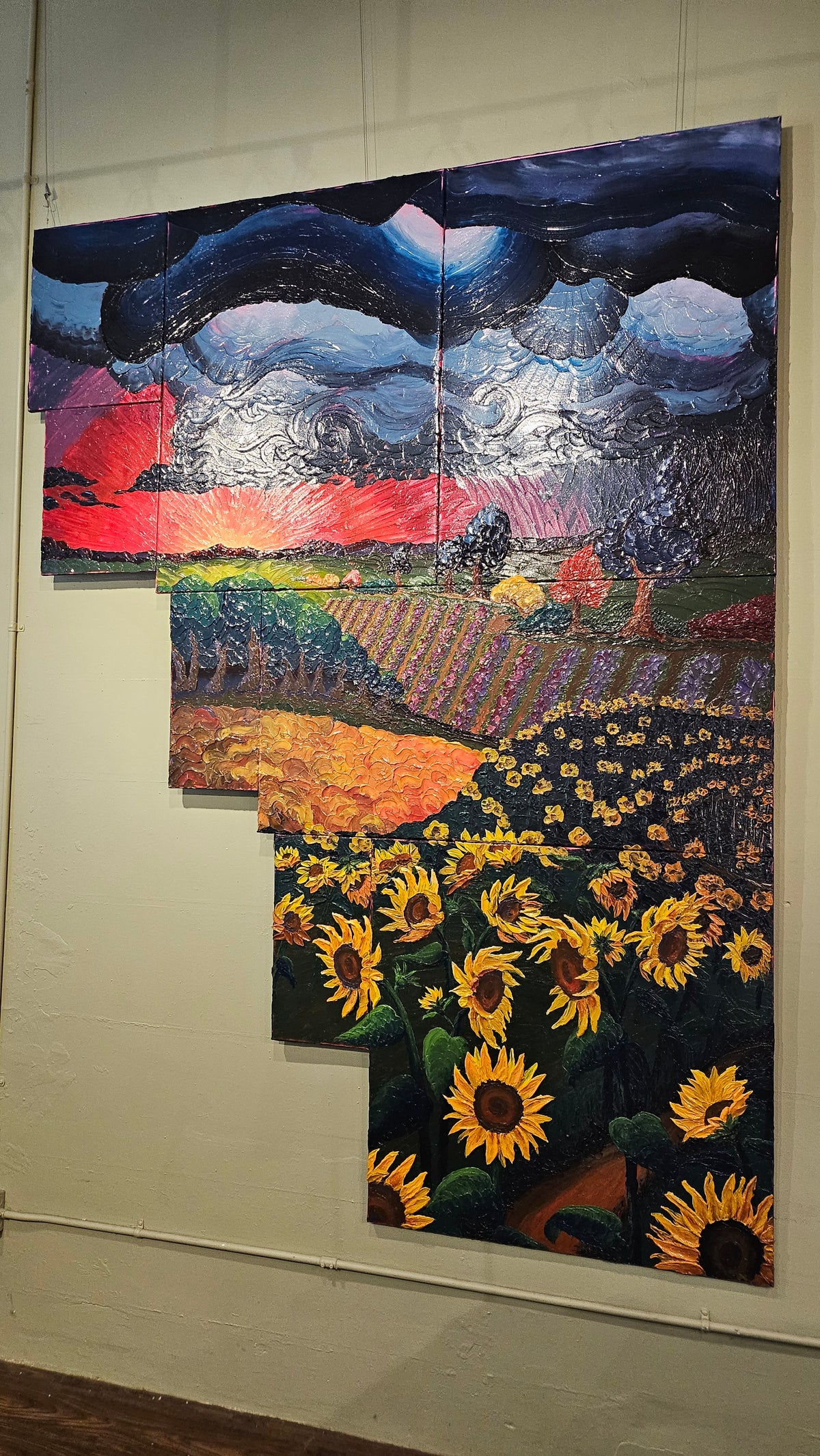 Painting of a field of sunflowers during a thunderstorm