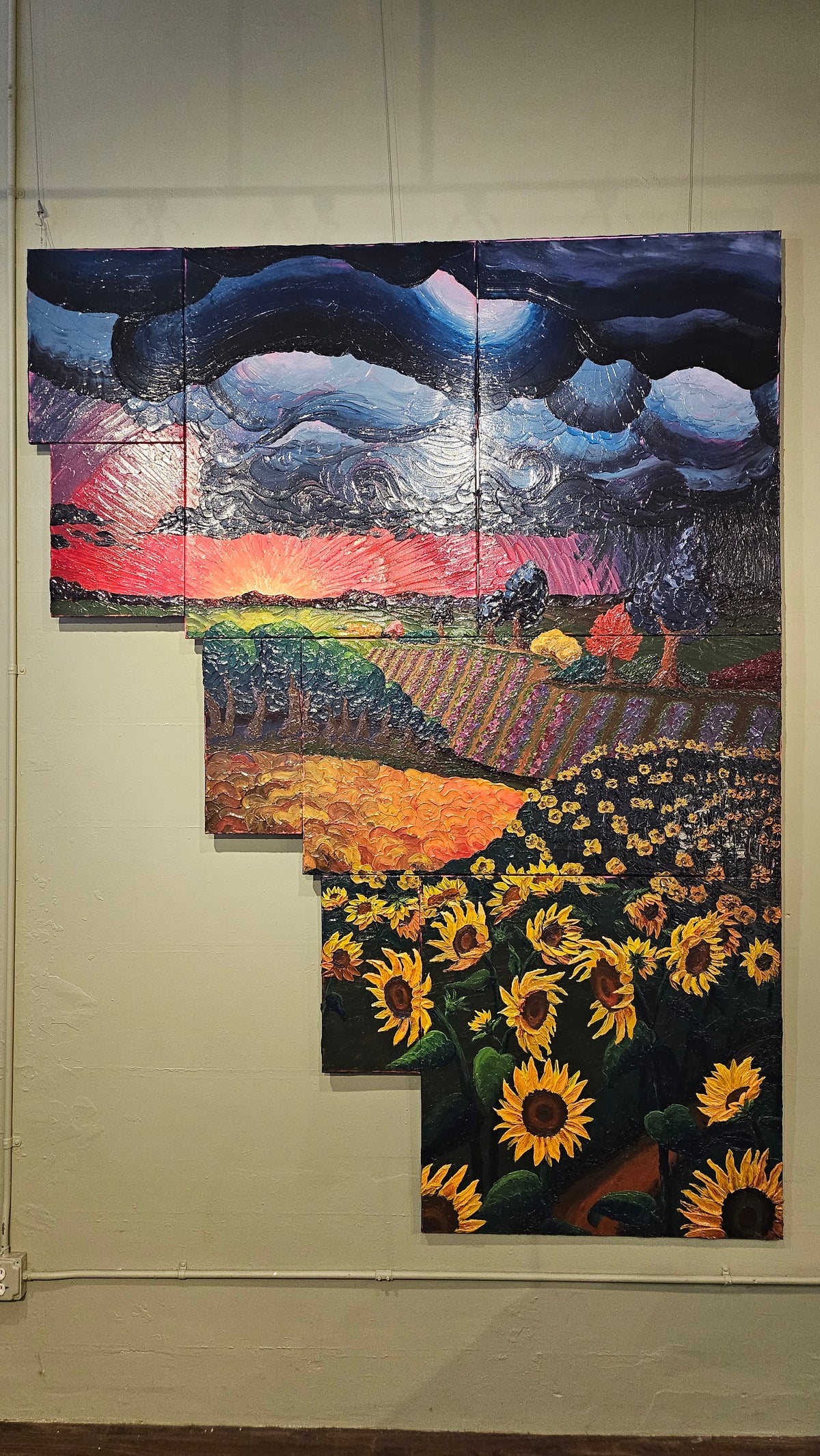Painting of a field of sunflowers during a thunderstorm