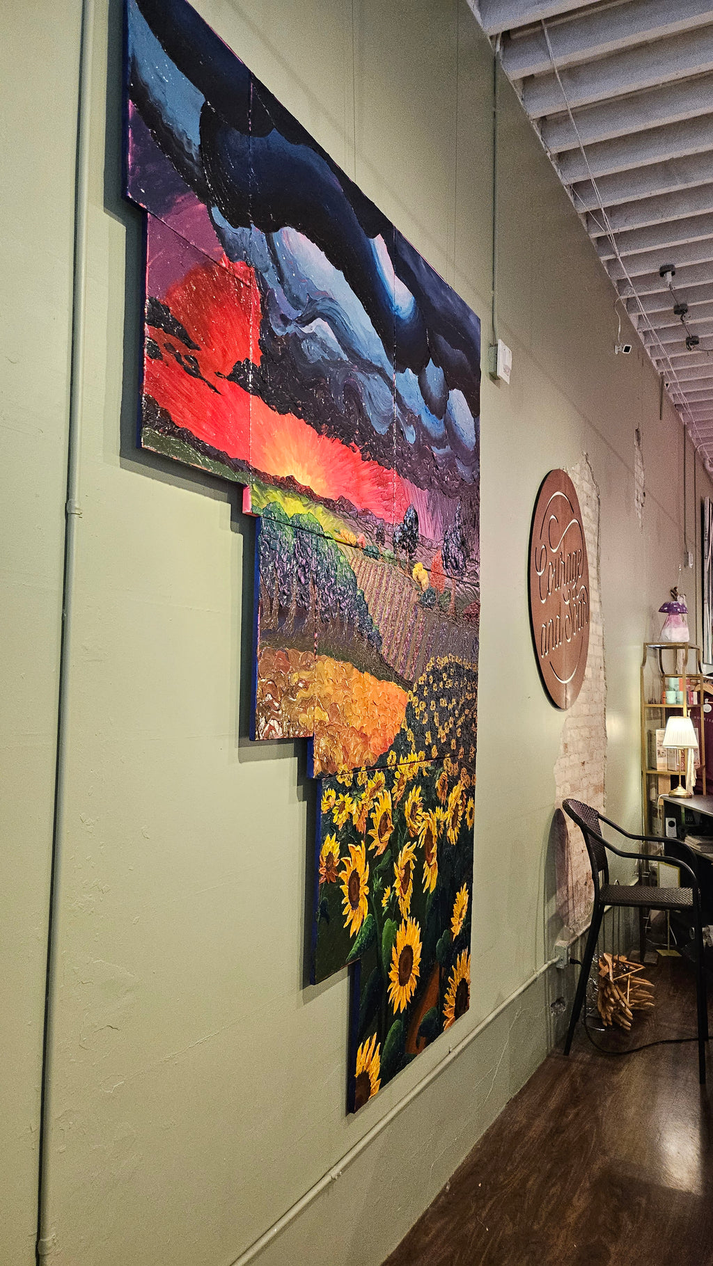 Painting of a field of sunflowers during a thunderstorm
