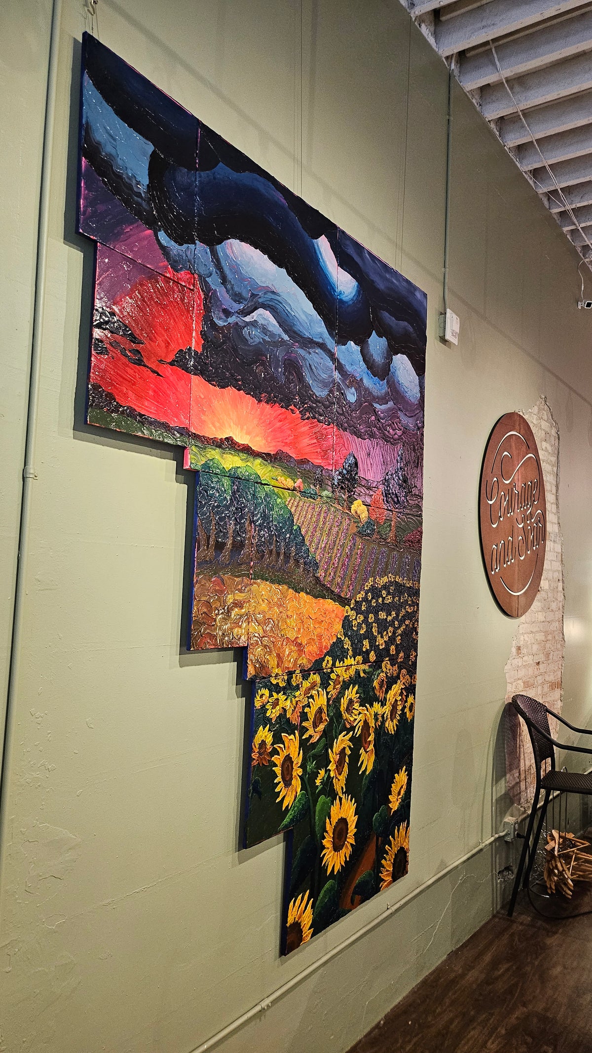 Painting of a field of sunflowers during a thunderstorm