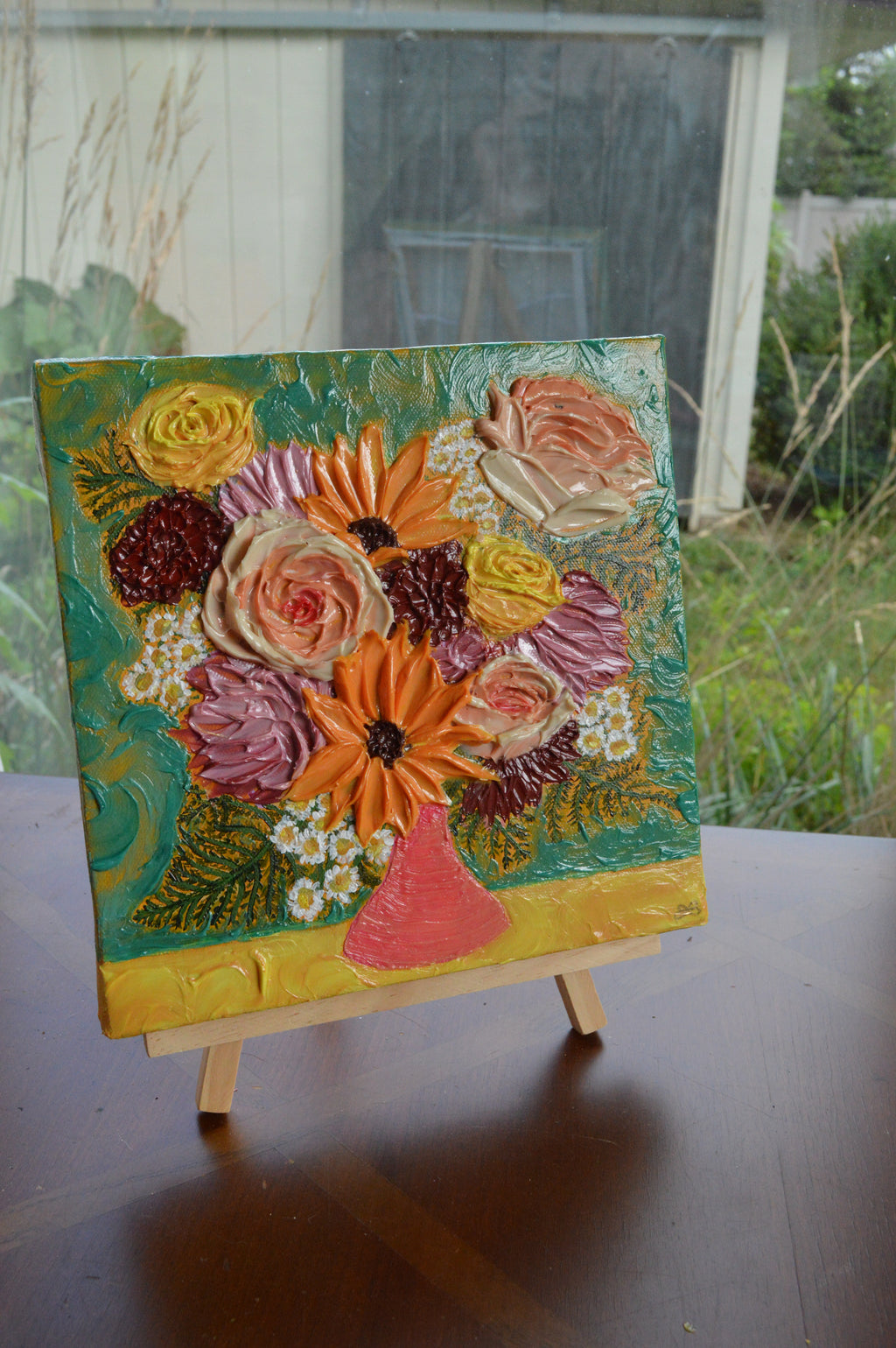 Painting of a pink, yellow, and purple bouquet