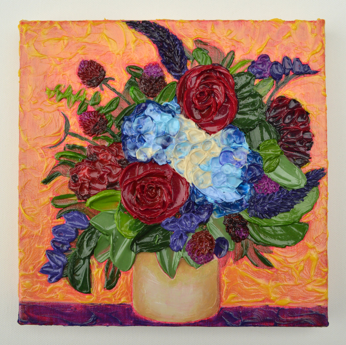 Painting of a blue, red, and purple bouquet