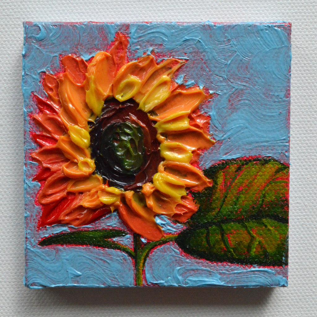 Mini painting of a sunflower and a blue sky